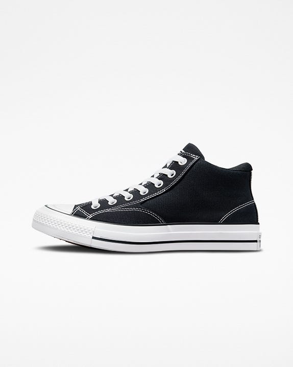 Half white top half black converse
